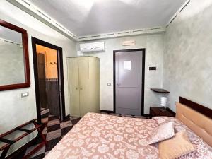 a bedroom with a bed in a room at La Poesia Apartment in Monterosso al Mare