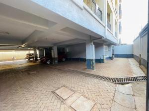 an empty parking lot in a building with a parking garage at Habun Homes in Ruaka +1 photo