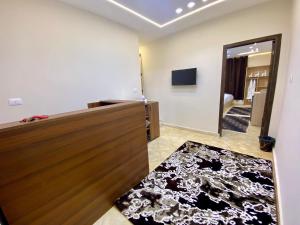 a room with a wooden door and a mirror at Isis Pyramids View Inn in Cairo
