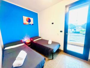 Postel nebo postele na pokoji v ubytování Casa vacanza ANIDA