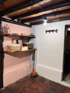 a room with a white door and a shelf at La cabaña de la abuela in Sutatausa +13 photos