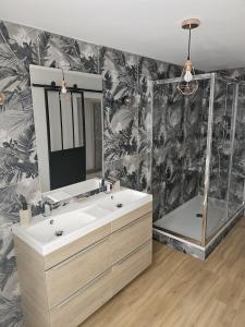 a bathroom with a sink and a mirror at 11 Remparts in Malaucène