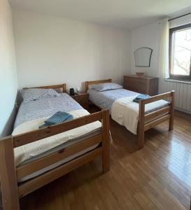Postel nebo postele na pokoji v ubytování Apartma Laganini + 8 fotografií