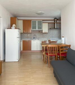 Kuchyň nebo kuchyňský kout v ubytování Apartma Laganini
