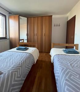 Postel nebo postele na pokoji v ubytování Apartma Laganini
