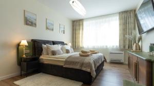 a bedroom with a bed with a teddy bear on it at LIMIDI HOMES --- Spacious Two-Bedroom Apartment in City Centre --- Ideal Location for Exploring Veliko Tarnovo in Veliko Tŭrnovo