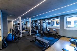 a gym with treadmills and elliptical machines at Ozped Private Flats Comfort Suites in Brasília