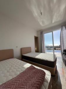 Ένα ή περισσότερα κρεβάτια σε δωμάτιο στο Queen Eyridiki Luxury Villa 1