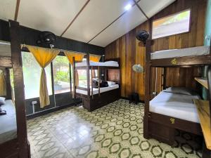 Postel nebo postele na pokoji v ubytování Hostel Casa de las Palmas Tours + 37 fotografií