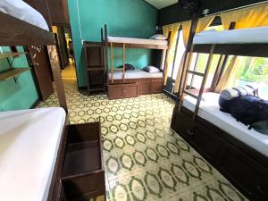 Un ou plusieurs lits dans un hébergement de l'établissement Hostel Casa de las Palmas Tours