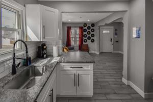 a kitchen with a sink and a counter top at groovy apartment in the heart of the city in Denver