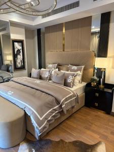 a bedroom with a large bed in a room at Oyster court gulberg in Lahore