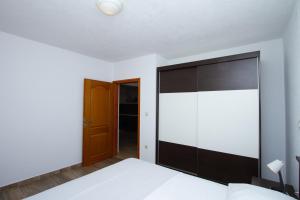 Postel nebo postele na pokoji v ubytování Apartman Francesca