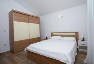 Postel nebo postele na pokoji v ubytování Apartman Francesca