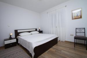 Postel nebo postele na pokoji v ubytování Apartman Francesca
