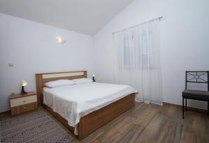 Postel nebo postele na pokoji v ubytování Apartman Francesca