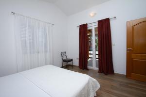 Postel nebo postele na pokoji v ubytování Apartman Francesca