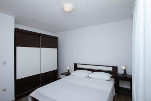 Postel nebo postele na pokoji v ubytování Apartman Francesca