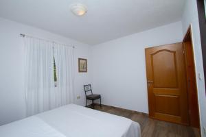 Postel nebo postele na pokoji v ubytování Apartman Francesca