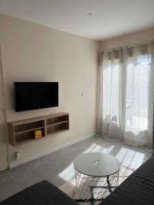 TV a/nebo společenská místnost v ubytování Cottage Dolce vita à Bobital + 33 fotografií