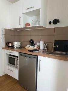 Η κουζίνα ή μικρή κουζίνα στο Suite romantique - Jolies Courbes +6 φωτογραφίες