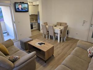 a living room with a couch and a table at Varosmala in Novi Pazar