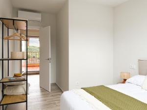 Ένα ή περισσότερα κρεβάτια σε δωμάτιο στο ChillaHomes 202