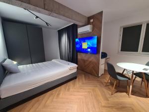 Ένα ή περισσότερα κρεβάτια σε δωμάτιο στο Arena Park