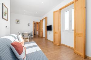 a bedroom with a bed and a hallway with a table at Casa os Gauleses in Gaula