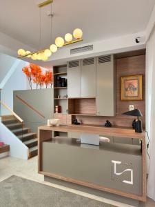 a kitchen with a counter and a staircase at Timeless - Old City in Lisbon