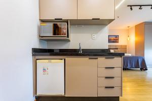 Køkken eller tekøkken på Apartamento no Comfort hotel Taguatinga