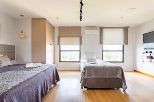 En eller flere senge i et værelse på Apartamento no Comfort hotel Taguatinga