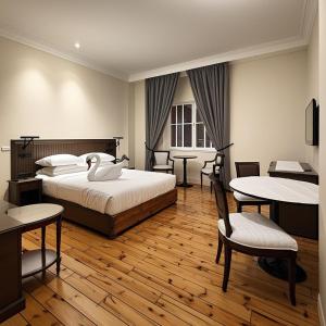 Postel nebo postele na pokoji v ubytování havana hotel
