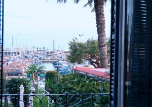 a view from a balcony of a marina with boats at Entire Flat First Beach line - Sea Views - Vilanova i Geltru in Vilanova i la Geltrú +28 photos