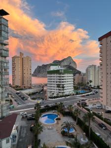 a view of a city with buildings and a mountain at Rock&Bike Calpe Sunny Apartment in Calpe