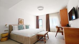 Postel nebo postele na pokoji v ubytování VILLA MARGARIT Boutique Hotel