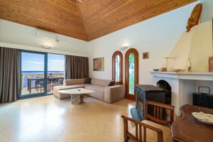 a living room with a couch and a fireplace at Apartment Kekia in Dubrovnik