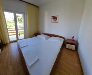 Postel nebo postele na pokoji v ubytování Villa Suzana