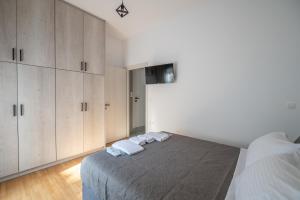 Postel nebo postele na pokoji v ubytování La Terra Nostra city