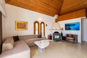 a living room with a couch and a fireplace at Apartment Kekia in Dubrovnik