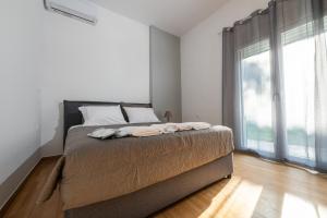 Postel nebo postele na pokoji v ubytování La Terra Nostra city