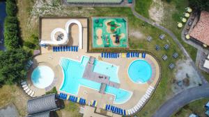 an overhead view of a swimming pool and a resort at Cocooning Tipi - Azur in Azur