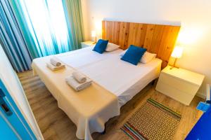 Postel nebo postele na pokoji v ubytování Hostel AzorAzul - Pool & Suite