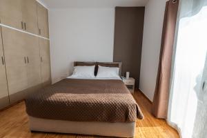 Postel nebo postele na pokoji v ubytování La Terra Nostra city