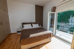 Postel nebo postele na pokoji v ubytování La Terra Nostra city