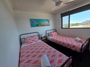 a bedroom with two beds and a window at Wharf Street Vista in Forster