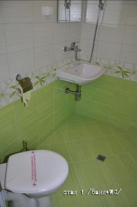 a bathroom with a white sink and a toilet at Лорета-Камен бряг in Kamen Bryag +94 photos