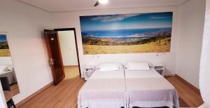 Postel nebo postele na pokoji v ubytování Hostal Cachiño