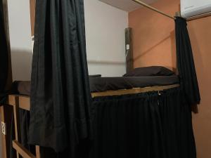 Postel nebo postele na pokoji v ubytování Maracuyá Hostal Zipolite