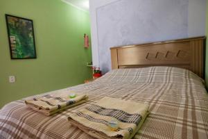 Postel nebo postele na pokoji v ubytování Pousada na trilha das artes